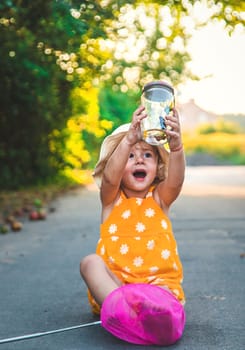 A child catches a butterfly in nature. selective focus. kid.