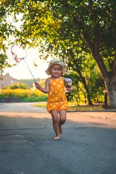 A child catches a butterfly in nature. selective focus. kid.