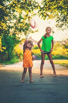 A child catches a butterfly in nature. selective focus. kid.