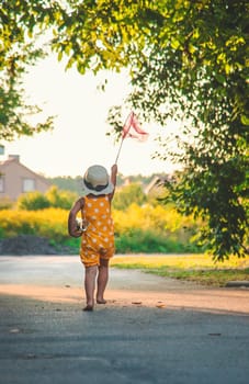 A child catches a butterfly in nature. selective focus. kid.