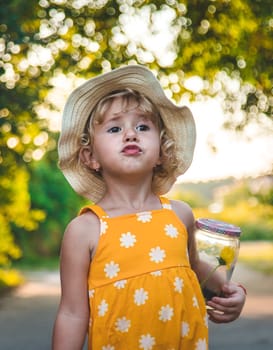 A child catches a butterfly in nature. selective focus. kid.