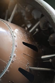 Old propeller airplane engine, closeup of machine details of vintage plane