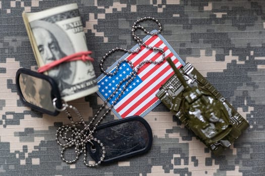 US and China flags on military uniform background for trade war concept . High quality photo