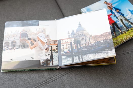 Family photos archive saved in brightly designed photo book; bright summer memories placed in the photobook. High quality photo