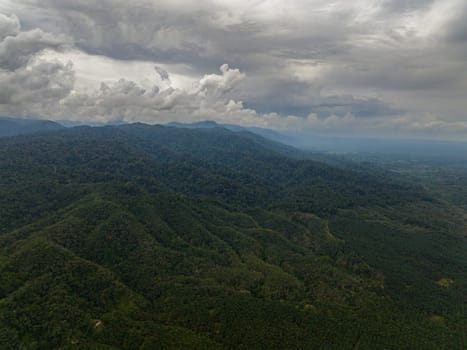 Aerial view of mountain landscape with mountain peaks covered with forest. Sumatra, Indonesia.