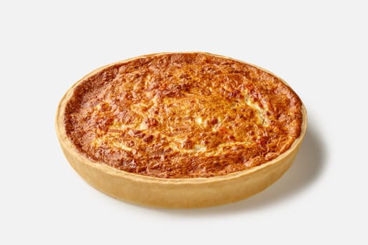 Delicious traditional French quiche with crispy shortbread crust filled with savory custard, cheese and salmon, isolated on white background