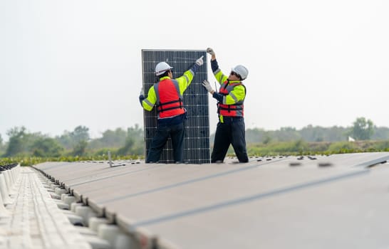 One professional technician worker stand and point to problem area and discuss with co-worker in area of base over water reservoir.