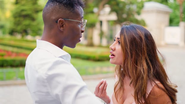 Very angry woman reproaching her partner for something on the street