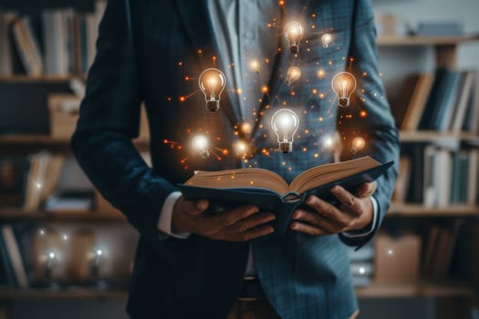 Portrait of man reading book and a light bulb, reading books for inspiration or looking for ideas.