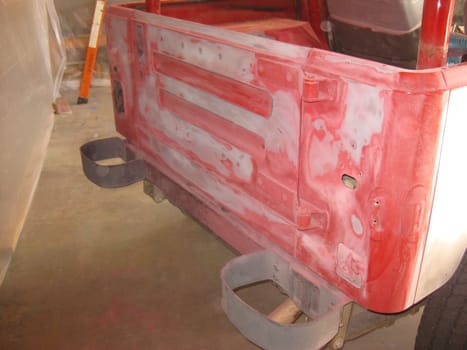 Auto Body Repair and Repainting Prep Work on Red Vehicle. High quality photo