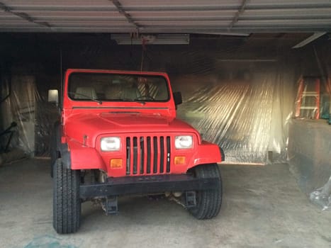 Auto Body Repair and Repainting Prep Work on Red Vehicle. High quality photo