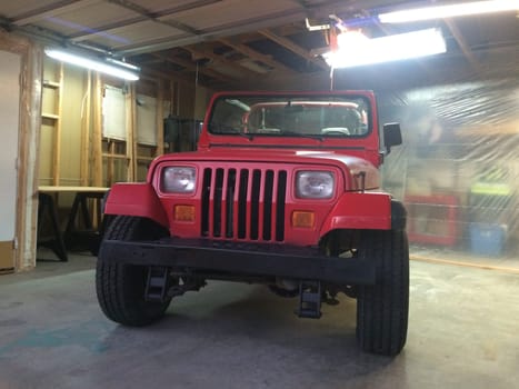 Auto Body Repair and Repainting Prep Work on Red Vehicle. High quality photo