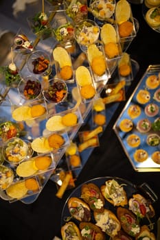 top view of snacks on a buffet table in an elite hotel.