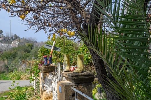 plants planted in rubber boots as a decorative element