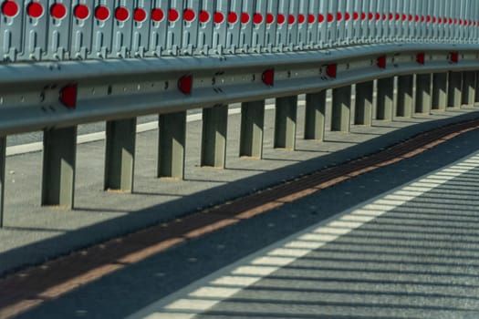 Safety barriers on highway. Anodized safety steel barrier. Enhancing highway safety