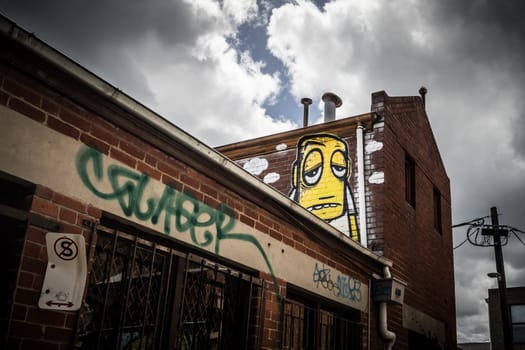 GEELONG, AUSTRALIA - JANUARY 26 2024: The laneways and artwork around Minns Lane near Little Malop St on a warm summer's morning in Geelong, Victoria, Australia