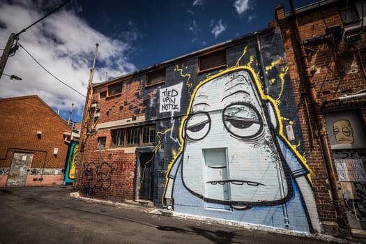 GEELONG, AUSTRALIA - JANUARY 26 2024: The laneways and artwork around Minns Lane near Little Malop St on a warm summer's morning in Geelong, Victoria, Australia