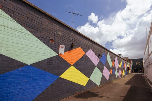 GEELONG, AUSTRALIA - JANUARY 26 2024: The laneways and artwork around Minns Lane near Little Malop St on a warm summer's morning in Geelong, Victoria, Australia