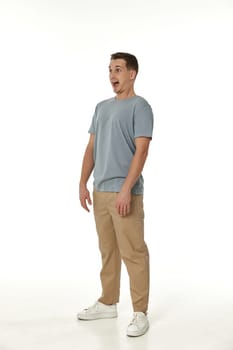 surprised guy looking at camera on white studio background