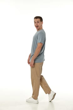 surprised guy looking at camera on white studio background