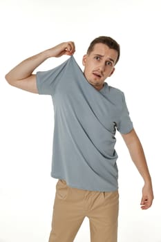 man holding himself by the shoulders isolated on white background