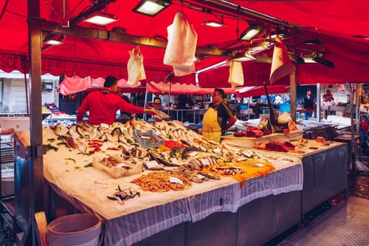 Catania, Italy - November 1, 2019: Seafood at fish market in Catania, Sicily, Italy. Fresh fish at the fish market in the old Town of Catania in the province of Sicily in Italy. 