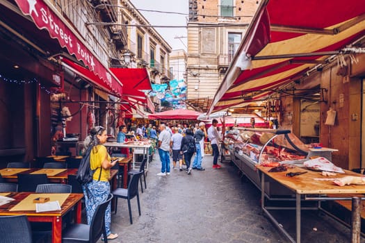 Catania, Italy - November 1, 2019: Seafood at fish market in Catania, Sicily, Italy. Fresh fish at the fish market in the old Town of Catania in the province of Sicily in Italy. 