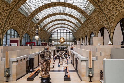 Paris, France - July 5, 2018: Visitors at the Musee d'Orsay in Paris. Located in the former Gare d'Orsay train station, the museum has the largest collection of impressionist paintings in the world.