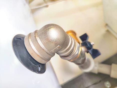 Close-Up of Domestic Water Shut-Off Valves. detailed view of the copper piping and two types of water shut-off valves typically installed in home plumbing system