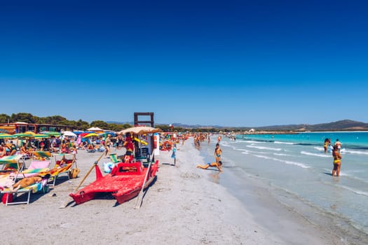 Porto Pino, Sardinia - July 20, 2019: View of beautiful sandy beach of Porto Pino, in the southern Sardinia, Italy. The Porto Pino beach with white sand and dunes, Sant’Anna Arresi, Sardinia, Italy