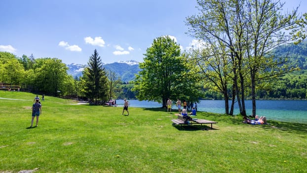 Bohinj, Slovenia - April 29, 2018: Lake Bohinj in Slovenia. Colorful summer on the Bohinj lake in Triglav national park Slovenia, Alps, Europe. Mountain Lake bohinj in Julian Alps, Slovenia