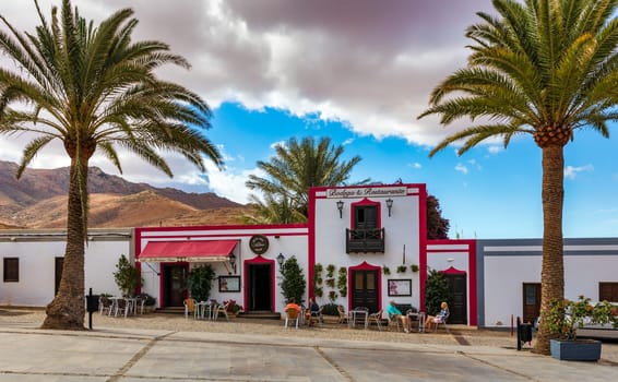 Betancuria, Fuerteventura - November 18, 2021: Cozy street with a typical house in the old town of Betancuria, Fuerteventura, Canary Islands, Spain. 