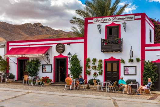 Betancuria, Fuerteventura - November 18, 2021: Cozy street with a typical house in the old town of Betancuria, Fuerteventura, Canary Islands, Spain. 
