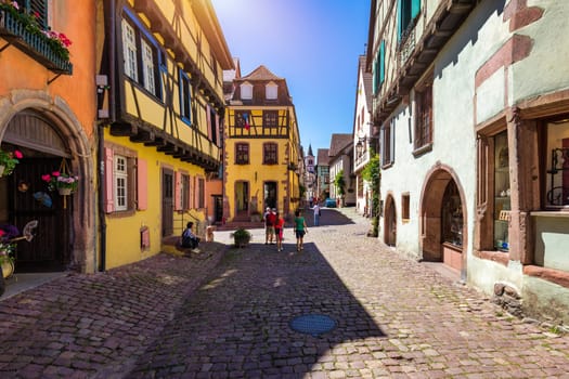 Riquewihr, France - July 2, 2022: Riquewihr village on Alsatian Wine Route, France. Most beautiful villages of France, Riquewihr in Alsace, famous "vine rote". Colorful town of Riquewihr, France.