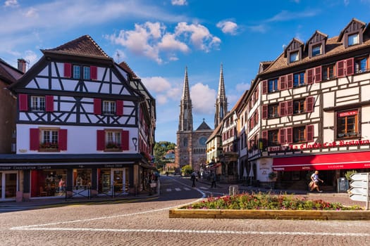 Obernai, France - 2 July 2022: Main square in Obernai, Alsace, France. Church of St. Peter and St. Paul in the center of Obernai, Bas-Rhin, Alsace, France