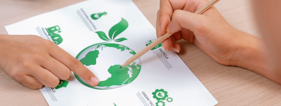 Businessman decide to invest in the green business project. Mind mapping presented environmental protection method. Environmental friendly and green business concept. Closeup. Delineation.