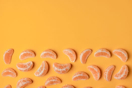 Collection of tangerine lobules, citrus food background with copy space
