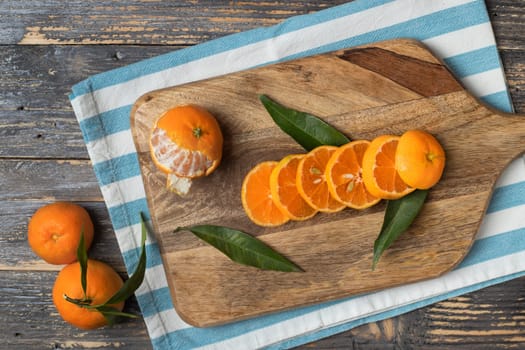 A composition of mandarins on a white background. Mandarin slices. Mandarin with leaves