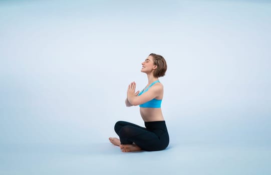 Full body length gaiety shot athletic and sporty woman doing healthy and meditative yoga exercise workout posture on isolated background. Healthy active and body care lifestyle