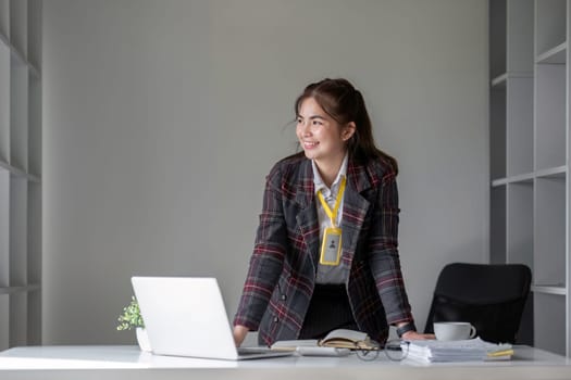 Portrait of a successful business woman Smiling happily at the desk..