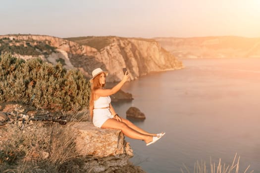 Selfie woman in cap and tank top making selfie shot mobile phone post photo social network outdoors on sea background beach people vacation lifestyle travel concept