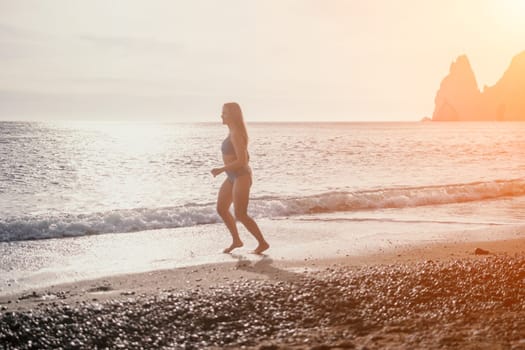 Running woman. Female runner jogging during the sunrise on beach. Woman Runner feet running on the beach at sunrise. woman fitness sunrise jog workout wellness concept.