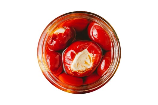 Stuffed cherry peppers with ricotta cheese filling in glass jar on white background