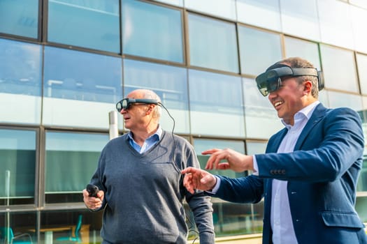 Senior and mature businessmen using the VR headset with actions outdoors next to a financial building