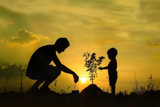 Father and son planting tree, concept of world environment day, Earth Day.