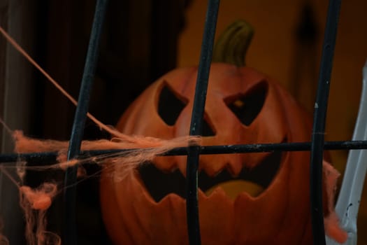 Halloween pumpkin in the dark. Eyes and mouth glow detail