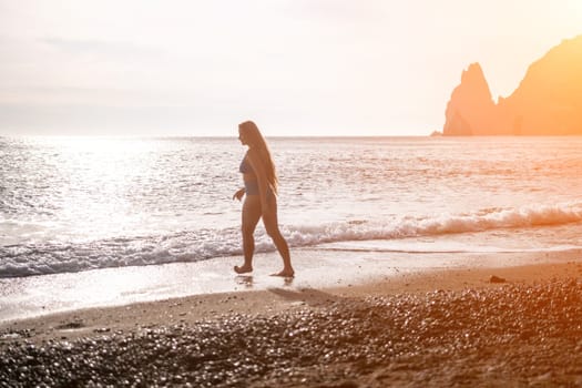 Running woman. Female runner jogging during the sunrise on beach. Woman Runner feet running on the beach at sunrise. woman fitness sunrise jog workout wellness concept.