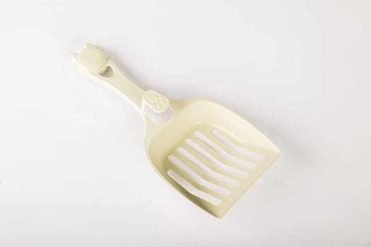 Maintain the purity of your cat's litter box with isolated metal cat litter scoops on a white background. It's all about care hygiene and cleanliness for your feline friend.