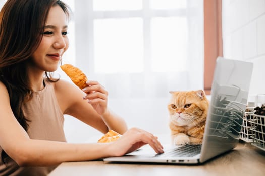 A young woman working diligently at her desk with a laptop, accompanied by her cuddly Scottish Fold cat. Their bond showcases the beauty of work and pet friendship.