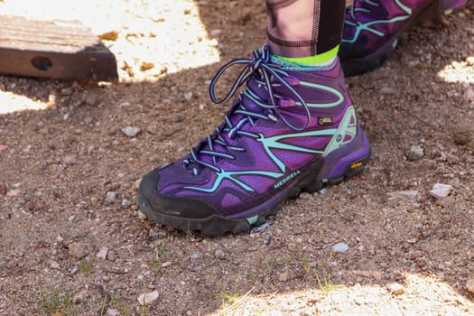 Purple merrel Women's hiking boot close up background . High quality photo